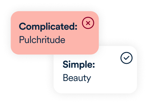 Two contrasting labels demonstrating word simplicity. The first label, on a red background, reads 'Complicated: Pulchritude' with a 'x' icon. The second label, on a white background, reads 'Simple: Beauty' with a checkmark icon.